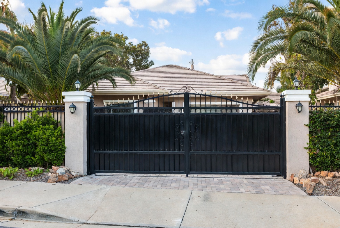 Farm fence with braced corners and wide gate